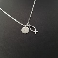 "Personalized Antique Silver Christian Fish Necklace! A detailed ichthys fish charm on a bright silver chain makes the perfect gift for you or a loved one. The Christian fish charm is made from zinc alloy and measures 20 mm by 8 mm. The chain is silver plated and measures 16\" or 18\" with a 1\" extender. You can also personalize your necklace with a .5\" silver plated disc stamped with the initial of your choice. To order your necklace WITHOUT a custom stamped initial disc, choose \"Charm & Chef Necklace, Fishing Bracelet, Christian Necklace, Fish Necklace, Etsy Personalized Gifts, Christian Jewelry, Birthstone Charms, Necklace Personalized, Personalized Necklace