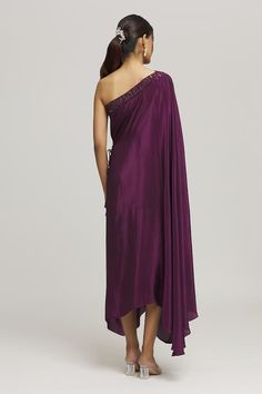 Purple one shoulder dress in a draped style and a solid flowy silhouette. - Aza Fashions Silk One-shoulder Pre-draped Dress, Silk Draped One Shoulder Dress For Evening, Pre-draped Silk One Shoulder Dress For Cocktails, Pre-draped Silk One-shoulder Dress For Cocktails, Pre-draped One Shoulder Silk Dress, Pre-draped One Shoulder Maxi Dress For Gala, Formal One Shoulder Dress With Draped Sleeves, Evening Dress With Draped Sleeves And Asymmetrical Neckline, One Shoulder Evening Dress With Draped Sleeves