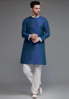 Cotton Silk Kurta in Dark BlueThis Readymade Chinese Collar Neck and Full Sleeve attire is Enhanced with ButtonsAvailable with a Cotton Silk Pant in WhiteDo note: Footwear shown in the image is for presentation purposes only. Half to one inch may vary in measurement. (Slight variation in actual color vs. image is possible) We sell all kinds of menswear. Mens Kurta | Mens Kurta Pajama | Mens Sherwani | Mens Sherwani Sets | Traditional Menswear | Partywear Menswear | Indian Mens Dresses | Diwali K Elegant Long Sleeve Blue Kurta, Elegant Blue Long Sleeve Kurta, Blue Long Sleeve Kurta For Formal Occasions, Formal Blue Long Sleeve Kurta, Menswear Indian, Mens Dresses, Indian Jackets, Silk Kurta Set, Vs Image