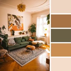 a living room filled with furniture and lots of greenery on top of a wooden floor