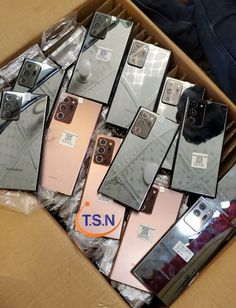 a box filled with different types of cell phones