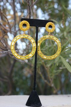 "These fun and stylish oversized citrine yellow hoop rhinestone earrings are a great statement piece! Pageant, photo shoots or fitness competitions! Size of earrings: 1.75\" Wide and 3\" Long. Color: Citrine Yellow rhinestones Style: Pierced and Clip On available. Just select preference under the \"Style\" tab Looking for a matching bracelet? Check out our listings or send us a message! https://www.etsy.com/listing/701653437/yellow-bracelet-yellow-rhinestone?ref=shop_home_active_58 https://www.e Yellow Prom, Bridal Clip, Yellow Bracelet, Fun Ornaments, Prom Earrings, Rose Gold Crystal, Crystal Hoop Earrings, Holiday Earring, Matching Bracelet