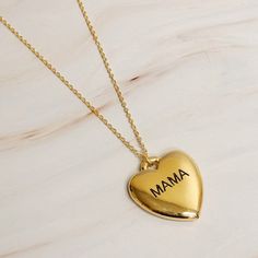 This Mama Engraved Heart Pendant Necklace is perfect for any mother. The heart lock pendant is nice and heavy, giving it a quality look and feel. With the word "mama" engraved, it adds a sentimental touch. Plus, the longer chain allows for versatile styling options. Show your love and appreciation with this timeless piece.Dimensions: approximately 18" chain with a 3" extenderLead and Nickel compliantMade In: China Jewlery Earrings, Heart Pendant Necklace Gold, Visor Hairstyles, Lock Pendant, Heart Lock, Kids Candy, Fine Jewelry Collection, Scrunchie Hairstyles, Stainless Steel Jewelry