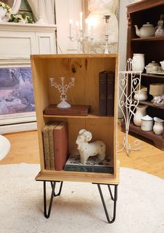 a book shelf with books and figurines in it