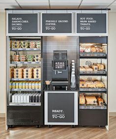 a display case in a grocery store filled with lots of food and drink options for sale