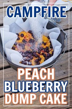 the cover of campfire peach blueberry dump cake is being sprinkled with water