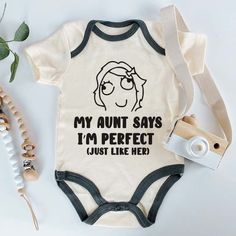 Celebrate the special bond between aunt and baby with this adorable 'My Aunt Says I'm Perfect' custom baby bodysuit! Perfect for nieces or nephews, this funny and cute outfit is ideal for pregnancy announcements, birth reveals, or baby showers. Made from soft, high-quality fabric, this unisex bodysuit is comfortable and stylish, featuring a playful saying that’s sure to bring a smile to Auntie's face. Whether it's a gift for a new baby or a fun way to announce 'coming soon,' this bodysuit is a must-have for every family. Available in multiple sizes and perfect for any occasion, it's a delightful way to celebrate the love and humor shared between an aunt and her little one! This baby bodysuit is machine washable, making it easy to care for. The romper is super soft and easy to wear and take Aunt Onsies, Birthday Baby Announcement, Pregnancy Announcement Aunt, Birth Reveal, Birth Plans, Auntie Baby, Aunt Quotes, Cute Pregnancy Announcement, Funny Pregnancy Announcement