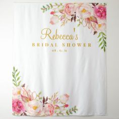 a floral bridal shower curtain with gold lettering on the front and bottom, along with pink flowers