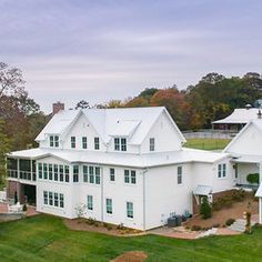 an aerial view of a large white house