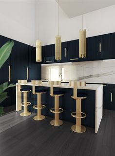 a kitchen with blue cabinets and gold bar stools