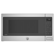 a silver microwave oven with the door open