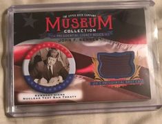 an item from the museum collection is on display in a plastic package with a flag