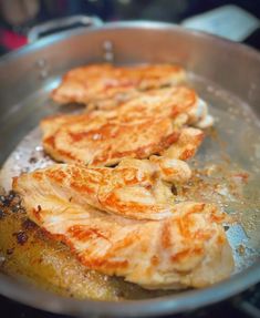 some food is cooking in a frying pan on the stove top and it looks like they have been fried