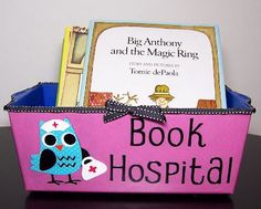 a pink book basket with an owl on it and a sign that says book hospital