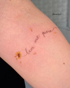 a woman's arm with the word love written in cursive writing on it