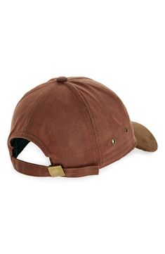 a baseball cap with a brown sued brimmed on the front and tan visor