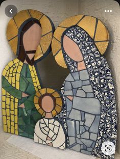 two mosaics depicting the virgin mary and jesus in blue, yellow and green colors