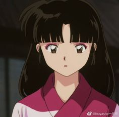 an anime character with long black hair wearing a pink and white shirt looking at the camera