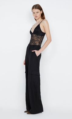 The BEC + BRIDGE Sashay Bodysuit features a v-neckline bra style front with transparent lace through the torso. Styled with BEC + BRIDGE Nevada Pocket Pant. Bec And Bridge, Bec Bridge, Bodysuit Black, Bra Style, Prom Dress Shopping, Frankies Bikinis, Bec & Bridge, Solid & Striped, Brides And Bridesmaids