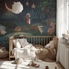 a child's room with a crib and wall mural