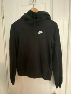 Very good pre-owned condition with minor fading. Measurements when laid flat: Shoulders: 15” Chest: 18” Waistband: 16.5” (stretches) Sleeve from seam: 24.5” Length from shoulder: 21” (H-A6) Black Nike Hoodie, Nike Streetwear, Black Hoodie Women, Women's Sportswear, Nike Pullover, Nike Sweatshirts, Neck Hoodie, Nike Hoodie