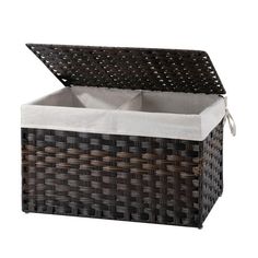 an outdoor wicker storage box with white canvas linings and brown weaved lid