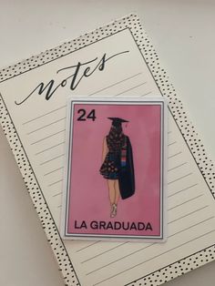 a note pad with an image of a woman in a graduation gown on it and the words notes 24 la graduada