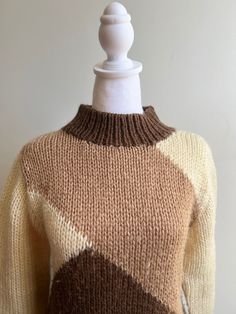 Vintage acrylic ski sweater Diagonal graphic knit pattern Mid collar Cream, tan and chocolate brown Super soft and classic Size Men's Small Shoulder to shoulder 17" Chest 38" Length 25" Sleeve 23" Fitted Brown Crew Neck Sweater, Retro Beige Knitted Sweater, Beige Knitted Retro Sweater, Retro Beige Knit Sweater, Fitted Brown Knitted Sweater, Brown Argyle Pattern Long Sleeve Sweater, Brown Argyle Long Sleeve Sweater, Brown Argyle Sweater For Fall, Brown Long Sleeve Argyle Sweater