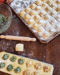 some food is laying out on a table next to a cookie sheet and baking utensils