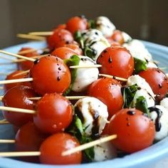 skewered tomatoes and mozzarella on toothpicks are ready to be eaten