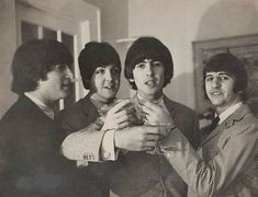 the beatles are posing for a photo together