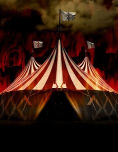 a circus tent with red and white stripes on it's sides, in front of dark clouds