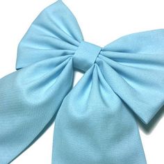 "This light blue hair bow will go perfectly with your school uniform, your cheerleader or dance outfit, or whatever occasion you want stand out of a crowd. It can also be used to complement a cosplay costume, not just as a hair bow, but as a bow attached to complete the look on your costume This hair bow is handmade on solid cotton fabric. For your convenience, I offer different hair clips so you can choose the one that meet your needs. You can also choose to NOT have a hair clip attached to the Sky Blue Hair Color, Sky Blue Hair, Baby Blue Hair, Blue Hair Bow, Hairstyles For Gowns, Blue Hair Color, Belle Cosplay, Blue Hair Bows, Blue Hair Accessories