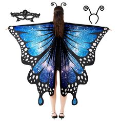 a woman wearing a blue butterfly costume with black wings and white dots on the wings