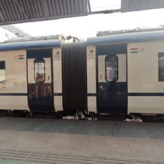 the train is stopped at the station waiting for passengers to get on or off it