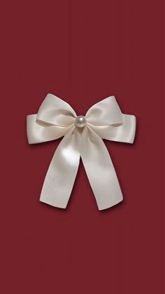 a white bow on a red background