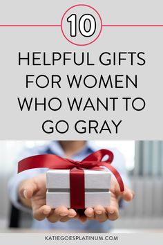 a woman holding a gift box with the words 10 helpful gifts for women who want to go gray