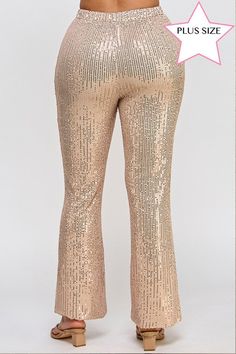 Be the shining star of any event with our Plus Size Sequin Flare Pants. These pants will add a touch of glamour to your outfit with their sparkling sequin design. Feel confident and stylish as you make a statement in these elegant pants. Perfect for any special occasion. Sequins flare pants with elastic waistband. Model is wearing size 1X Height: 5'10" Bust: 34 Waist: 24 Hip: 35 Fabric Contents 100% Polyester Disco Style Sequin Bottoms For Party Season, Disco Sequin Bottoms For Party Season, Glamorous Holiday Bottoms With Contrast Sequin, Glamorous Contrast Sequin Bottoms For Party Season, Glamorous Festive Bottoms With Contrast Sequin, Gold Sequined Evening Pants, Holiday Party Bottoms With Contrast Sequin, Glamorous Embellished Bottoms For Night Out, Party Bottoms With Contrast Sequin And Stretch