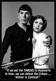 a man and woman standing next to each other in front of a star wars poster