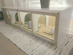 an animal cage is sitting on the floor