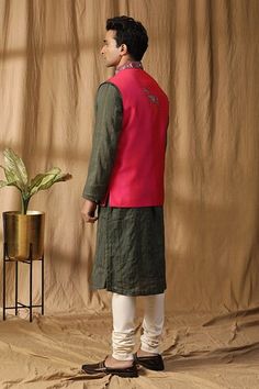 Pink silk dual toned bundi with ancient motif embroidery. Paired with a green contrasting kurta and off white churidar. - Aza Fashions Traditional Green Bandhgala With Stand Collar, Ceremonial Green Nehru Jacket With Chikankari Embroidery, Green Outerwear For Festive Diwali, Festive Outerwear With Woven Motifs, Off White Churidar, White Churidar, Kurta Set Men, Motif Embroidery, Pink Thread