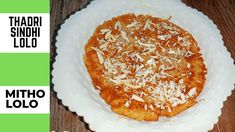 there is a small pizza on a paper plate with almonds and parmesan cheese