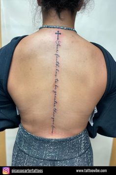 the back of a woman's neck with writing on it