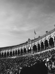 a large crowd is in the stands at a baseball game