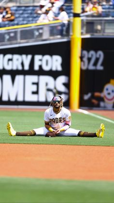 a baseball player is laying on the ground