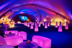 an indoor event with purple and blue lighting