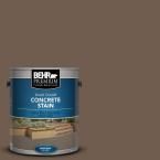 a can of behr premium concrete stain on a dark gray background with the words, concrete