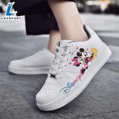 Disney Colorful Mickey Hugging Minnie AF1 Sneaker For Disney Fan Embrace timeless style and comfort with Nike Air Force 1 Shoes. Featuring a classic design with premium leather and a cushioned Air-Sole unit, these sneakers offer exceptional support and durability. The durable rubber outsole ensures excellent traction, making them perfect for everyday wear. Available in a range of colors, Air Force 1 Shoes effortlessly blend into any wardrobe while maintaining their iconic appeal. Photos Of Disne Cartoon Print Sneakers For Streetwear, Cartoon Character Print Low-top Sneakers, Cartoon Print Sneakers With Round Toe, Cartoon Sneakers With Rubber Sole And Round Toe, Synthetic Sneakers With Character Print And Round Toe, Disney Low-top Sneakers With Rubber Sole, Disney Character Print Sneakers With Round Toe, Casual Mickey Mouse Lace-up Sneakers, Cartoon Print Lace-up Sneakers For Streetwear