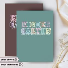 two notebooks with the words kinder gartern on them and some flowers