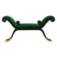 a green and black bench with gold accents